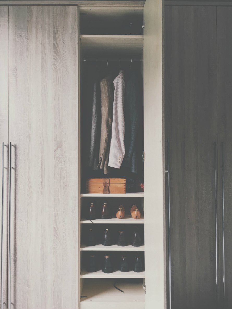 clothes organised in a wardrobe